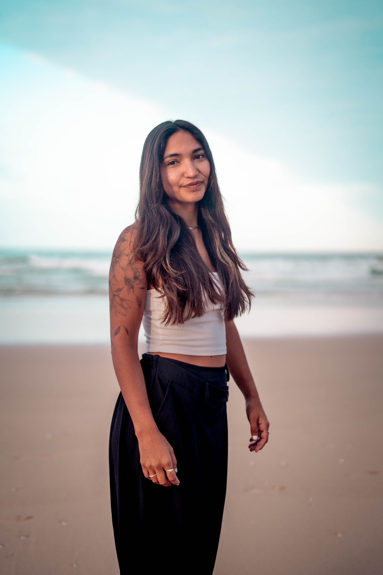 Mila Di Bella smiling on the beach in Lisbon